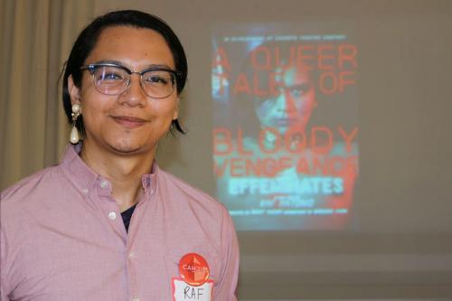 Artist Raf Antonio with the poster for Cahoots Theatre's The Effeminates: A Queer Tale of Bloody Vengeance